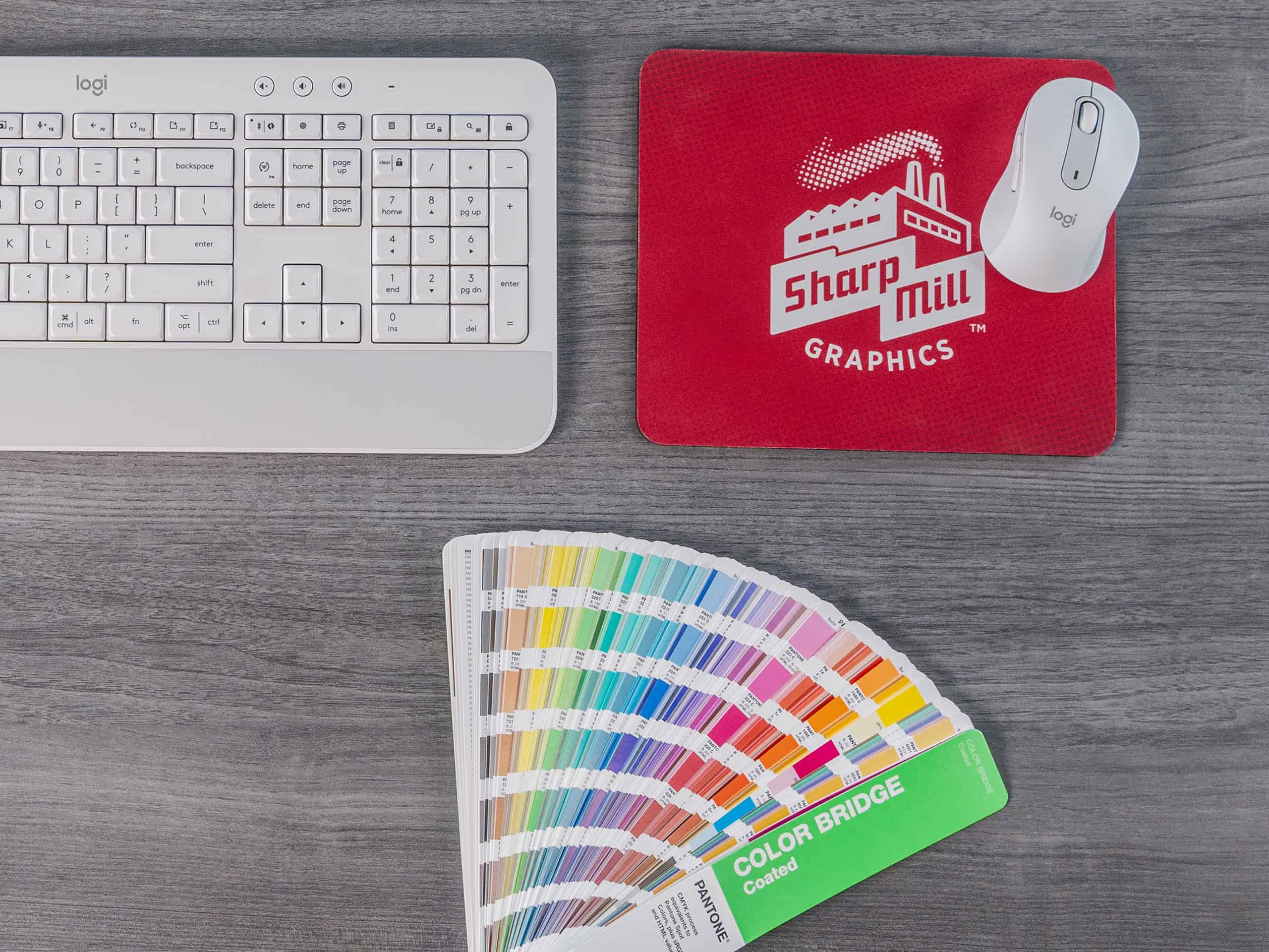 Branded mousepad with color palette and keyboard.