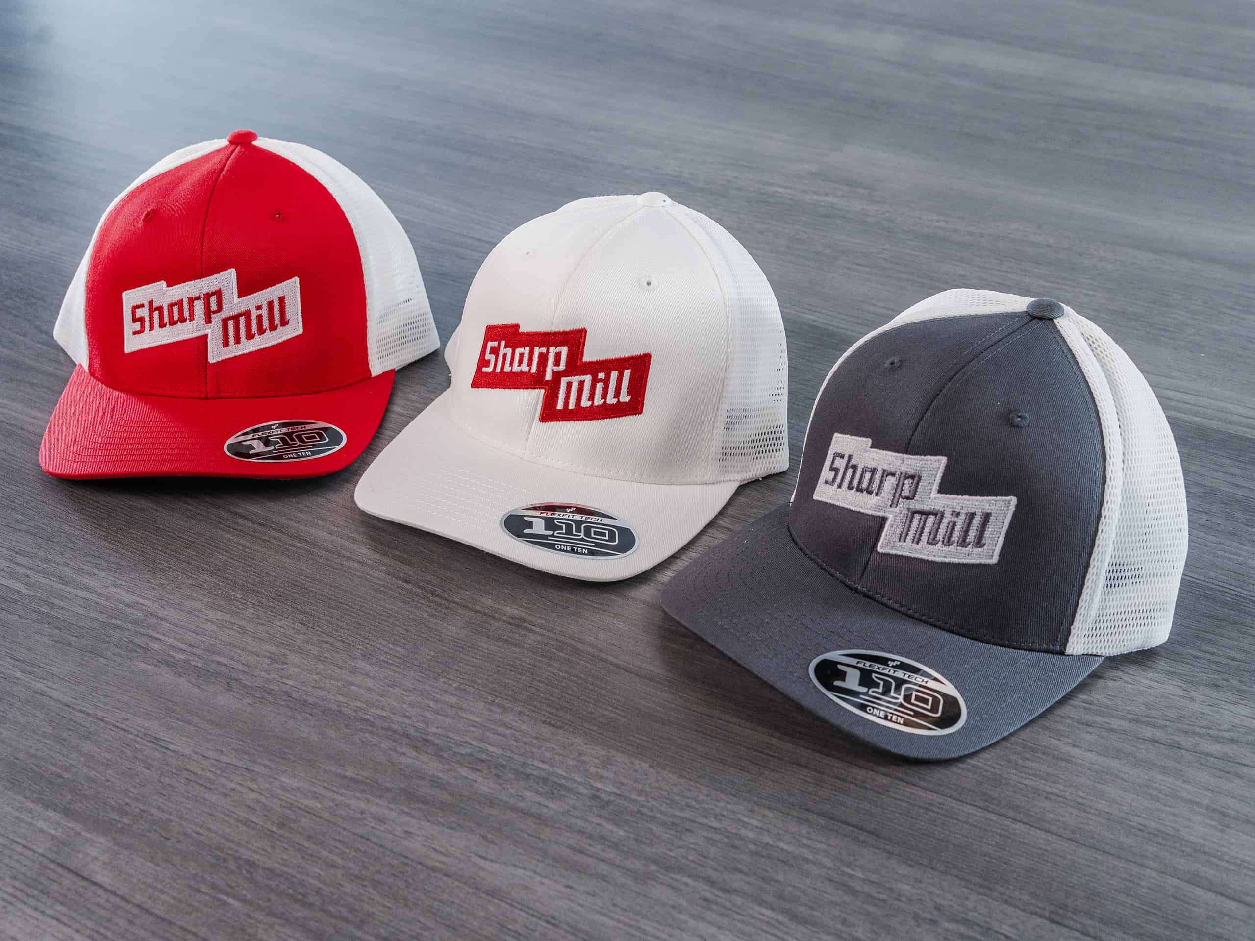 Three hats with Sharp Mill logo embroidered.