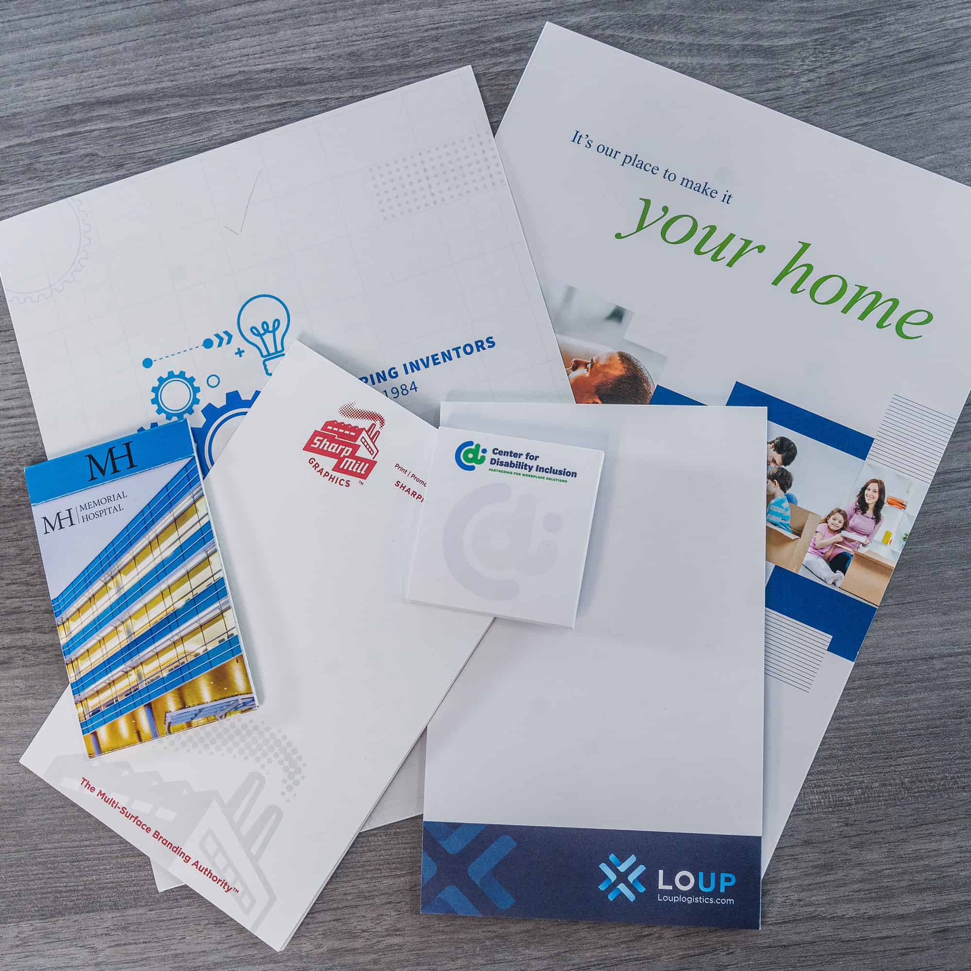 A set of business cards, letterheads, and envelopes showcasing commercial printing.